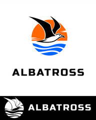 Fototapeta premium Colorful and minimalist logo design featuring a soaring albatross seabird silhouette against a sunset and ocean wave background
