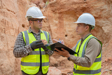Geologist surveying mine,Explorers collect soil samples to look for minerals, A geologist is a...