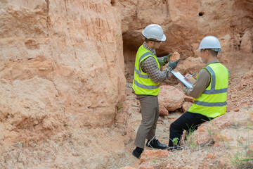Geologist surveying mine,Explorers collect soil samples to look for minerals, A geologist is a...