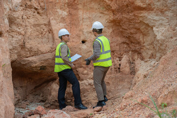 Geologist surveying mine,Explorers collect soil samples to look for minerals, A geologist is a...