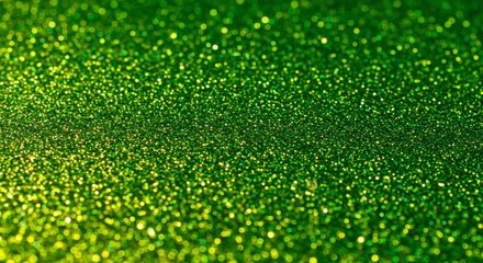 Sparkling green glitter background texture. Shimmering, out-of-focus, vibrant