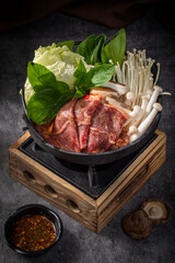 Asian Beef Hot Pot, Beef hot pot with fresh vegetables, beef hot pot served in traditional Asian style, beef hot pot recipe with mushrooms and greens