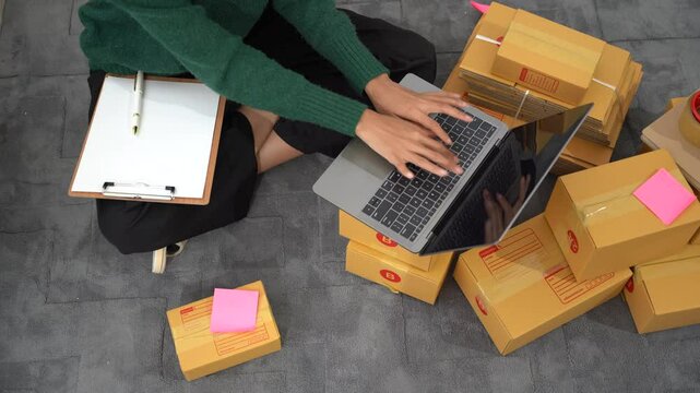 Online Business Owner: A female entrepreneur manages her online store, surrounded by shipping boxes and using a laptop.