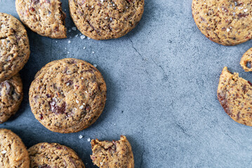 Perilla seeds chocolate chunk cookies on grey background.