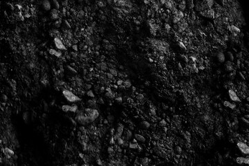 Black and white rough stone texture background with abstract grunge surface pattern