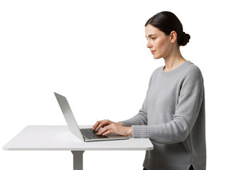 Standing woman using laptop on plane table, casual style, isolated on transparent background, PNG format