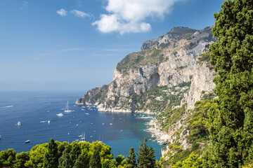 Capri Island in summer seen from Belvedere di Tragara viewpoint, Campania, Italy