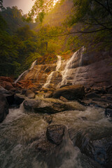 waterfall in the mountains at Curug Cikanteh Ciletuh National Geopark Sukabumi West Java Indonesia