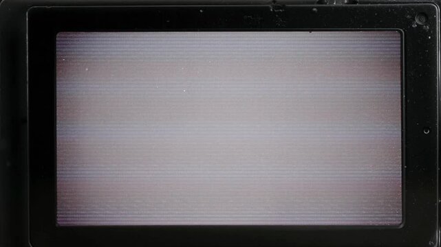 close up of mini dv camera side monitor with empty signal.