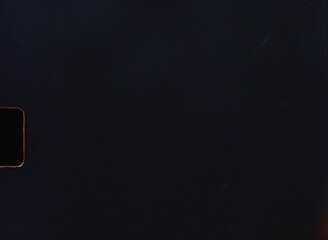 Old 8mm film background texture showing scratches and dust particles