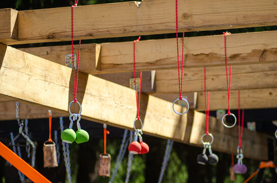 a challenging obstacle course rig with various hanging grips and rings