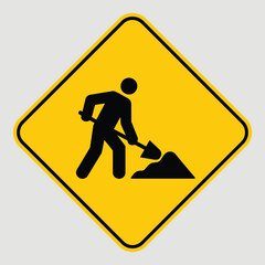 Yellow Diamond Road Sign Construction Worker with Shovel