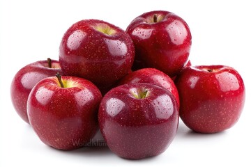 A cluster of seven glossy, dark-red apples with water droplets, arranged artfully against a stark white background