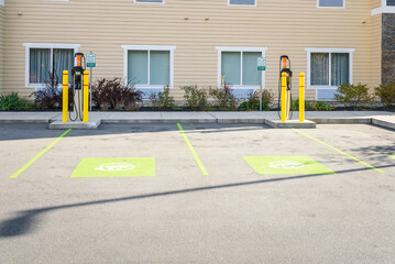 Empty charging station for electric cars in a car park on a sunny day
