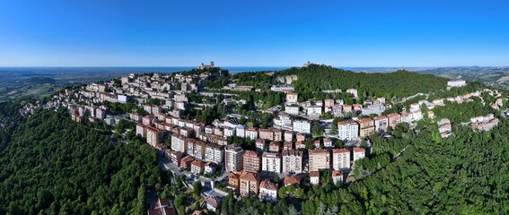 Fototapeta premium Aerial view of San Marino also known as the Most Serene Republic of San Marino an enclaved microstate surrounded by Italy, situated on the Italian Peninsula on the northeastern side of the Apennines