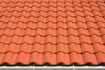 A vibrant and uniform pattern of terracotta roof tiles stretches across the frame, showcasing their...