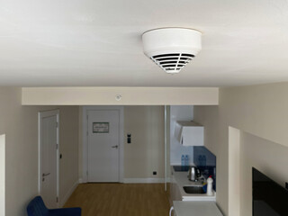Top view of fire safety alarm system sensor in hotel or home.