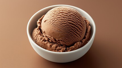 Creamy chocolate ice cream scoop in a white bowl