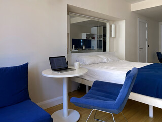 Interior of a small budget room in a hotel or motel.