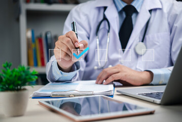 healthcare professional reviewing a patient medical record on a tablet while interacting with virtual icons and medical information displayed on the screen.