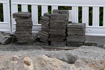 Concrete slabs and stones on a construction site, concept: infrastructure
