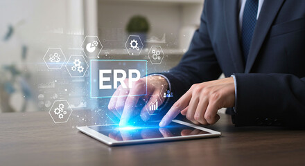 Man in suit using tablet with erp interface and icons overlayed on the screen in a bright light