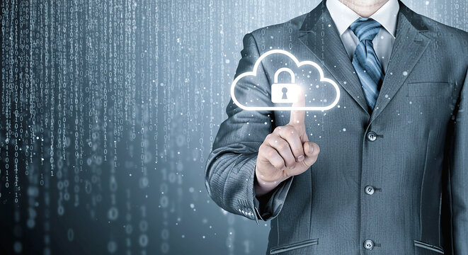 A man in a suit pointing at a cloud with a padlock in front of a digital background of binary code