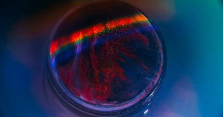 Paint light. Gleam art. Defocused purple red blue circle ink bright texture vibrant rainbow neon...