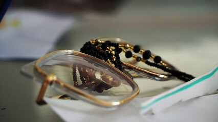 close-up of glasses on various papers
