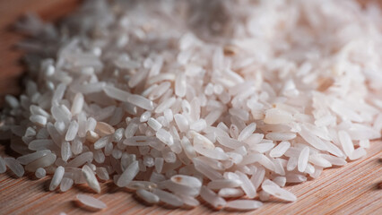 closeup of white rice on wooden table