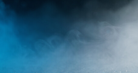 Bokeh vapor. Smoke cloud. Defocused blue white haze texture color ink swirling water flow floating on abstract dark black background.