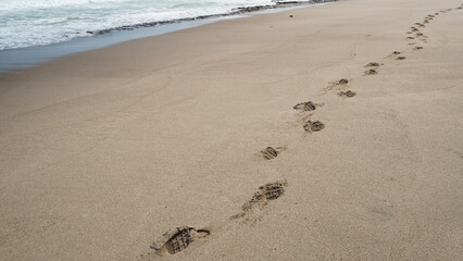 sandy beach with footprints