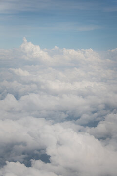 white cumulus clouds in the blue sky seen from high view point