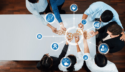 A diverse group of professionals collaborates during a business strategy session, utilizing modern...