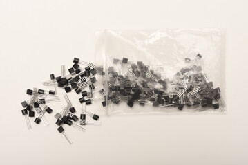 A scattering of plastic transistors. A bipolar transistor for electronics.
