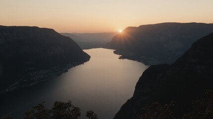 Serene lake at sunset, framed by mountains