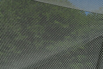 High-quality stainless steel mesh at animal enclosure. Technical, modern, clear structure....