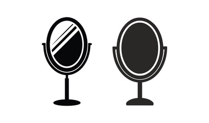 Two oval vanity mirrors on stands one reflecting light and the other solid black