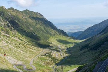 View of Transfăgărășan (trans + Făgăraș) or DN7C view. Transfagarasan road - Ceaușescu's Folly in Carpathian Mountains in Romania. The Transfăgărășan.	