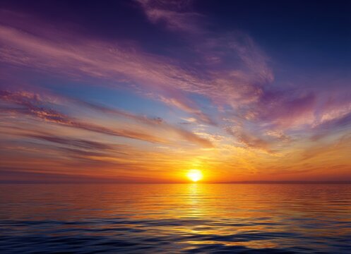 Beautiful sunset over the sea with  colorful sky and sun in the evening time