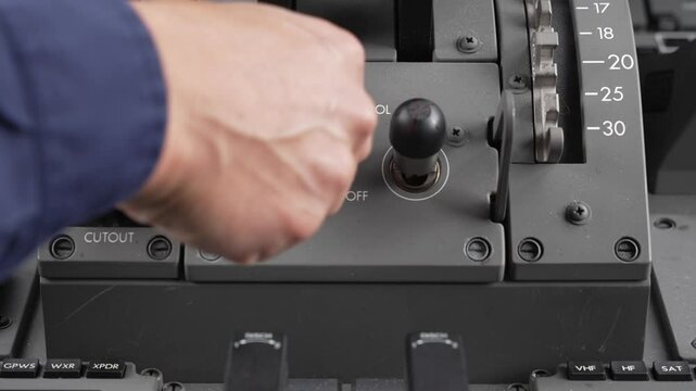 787 Fuel control switches being moved from the "run" position to the "cutoff" position.