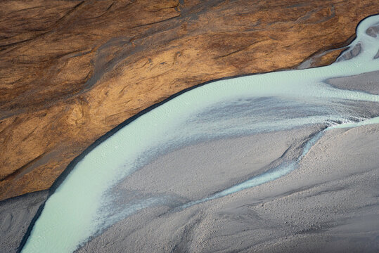 The contrast of colors and shapes in the Tasman River within the Southern Alps of New Zealand.