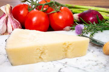 Pieces of matured pecorino romano italian cheese made from sheep milk in Lazio, Sardinia or Tuscany