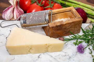 Pieces of matured pecorino romano italian cheese made from sheep milk in Lazio, Sardinia or Tuscany