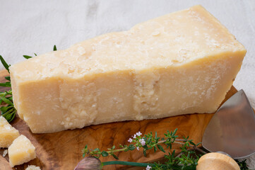 Traditional italian food, 36 months aged in caves Italian parmesan hard cheese from Parmigiano-Reggiano, Italy
