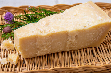 Traditional italian food, 36 months aged in caves Italian parmesan hard cheese from Parmigiano-Reggiano, Italy