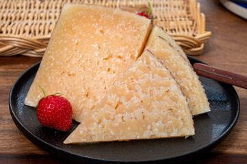 Very old anejo tostado Spanish hard cheese, cow and sheep curado, manchego, goat cheese close up
