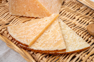 Very old anejo tostado Spanish hard cheese, cow and sheep curado, manchego, goat cheese close up