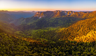 Sutjeska National Park in Bosnia and Herzegovina. Sunset in the mountains of Bosnia in the area of Prijevor and Veliki Maglic. Illuminated mountain massif on the border with Montenegro