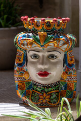 Sicilian folk art, traditional flower pots in  form of heads, colourful hand-painted pottery,...